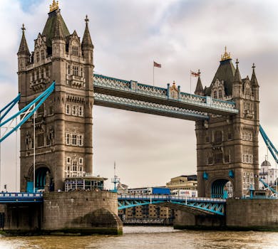 Our Destinations Stunning view of Tower Bridge with gothic architecture spanning the River Thames in London.